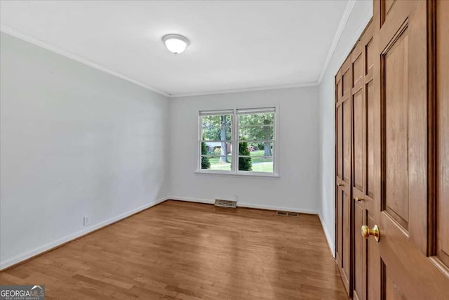612 Oakcrest Dr, Rockmart, GA 30153 - unfurnished bedroom featuring wood finished floors, crown molding, and baseboards