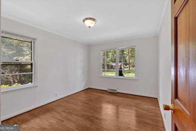 612 Oakcrest Dr, Rockmart, GA 30153 - empty room featuring plenty of natural light, crown molding, wood finished floors, and baseboards