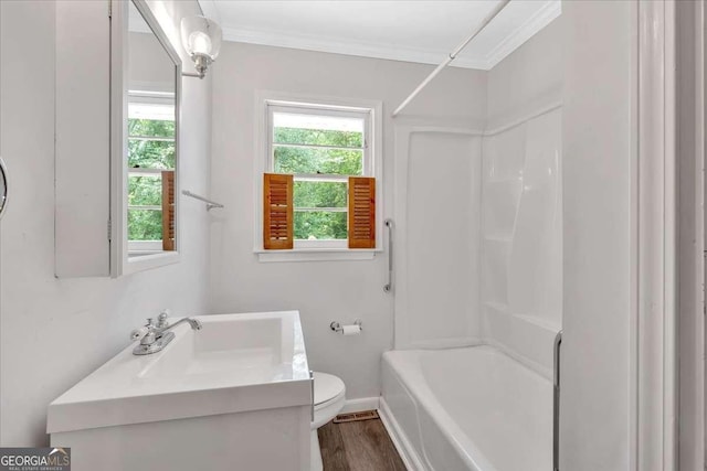 612 Oakcrest Dr, Rockmart, GA 30153 - bathroom featuring crown molding, toilet, vanity, shower / washtub combination, and baseboards