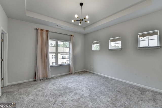 3360 Pickens St, Duluth, GA 30096 - spare room with a raised ceiling, a chandelier, carpet, and baseboards