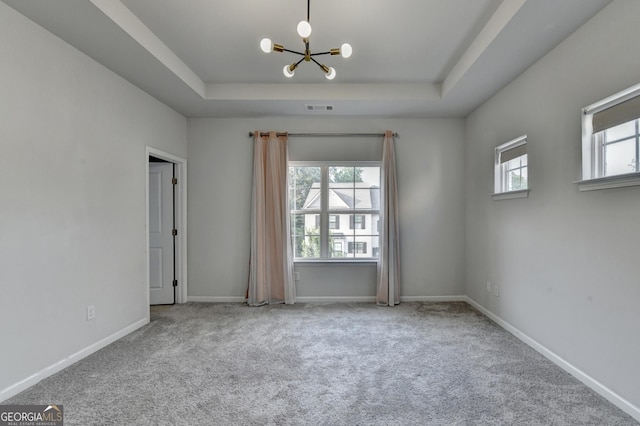 3360 Pickens St, Duluth, GA 30096 - carpeted empty room featuring a raised ceiling, a chandelier, and baseboards