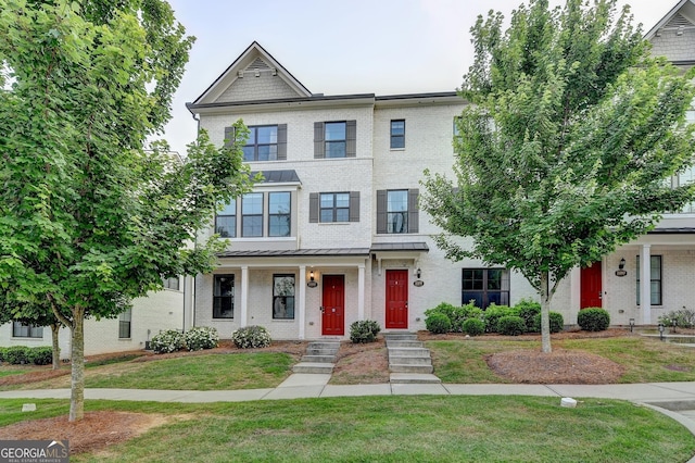 3360 Pickens St, Duluth, GA 30096 - townhome / multi-family property with brick siding and a front yard