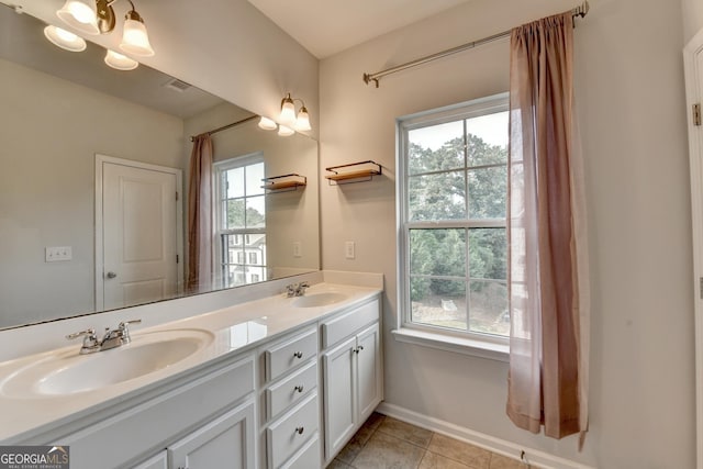 3360 Pickens St, Duluth, GA 30096 - full bath with double vanity, tile patterned flooring, and baseboards