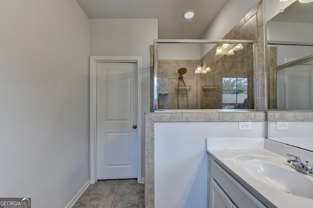 3360 Pickens St, Duluth, GA 30096 - bathroom featuring a tile shower, vanity, and tile patterned floors