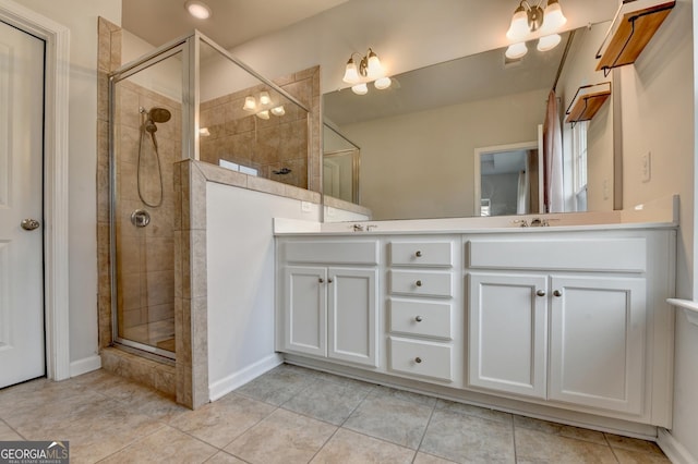 3360 Pickens St, Duluth, GA 30096 - bathroom with double vanity, a stall shower, and tile patterned floors