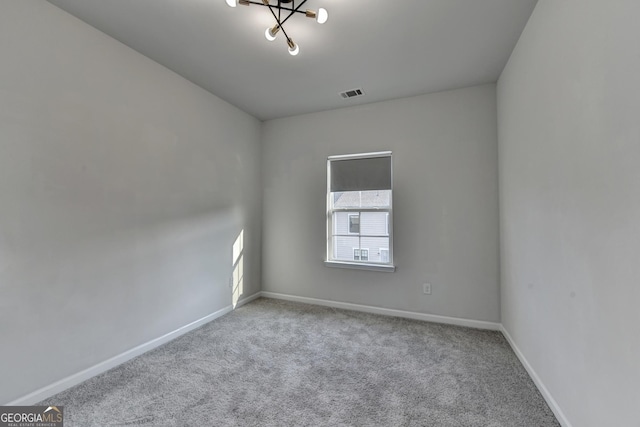 3360 Pickens St, Duluth, GA 30096 - carpeted spare room featuring a chandelier and baseboards
