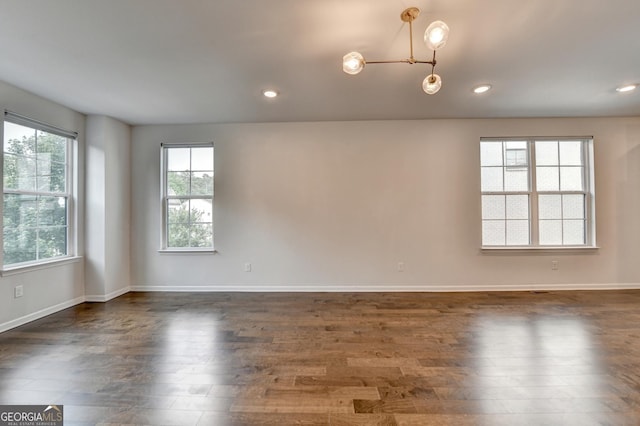 3360 Pickens St, Duluth, GA 30096 - empty room featuring dark wood finished floors, recessed lighting, and baseboards