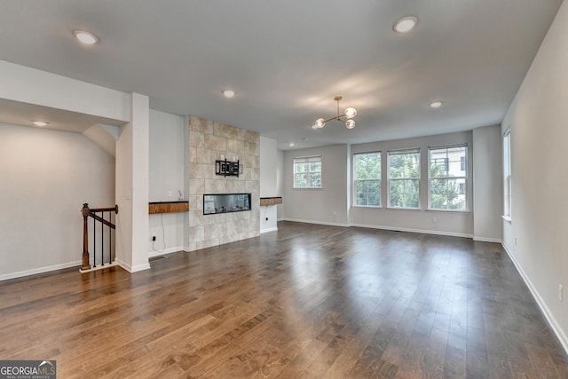3360 Pickens St, Duluth, GA 30096 - unfurnished living room featuring dark wood-style flooring, recessed lighting, baseboards, and a fireplace