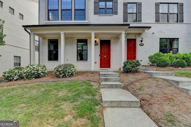 3360 Pickens St, Duluth, GA 30096 - doorway to property featuring brick siding and covered porch