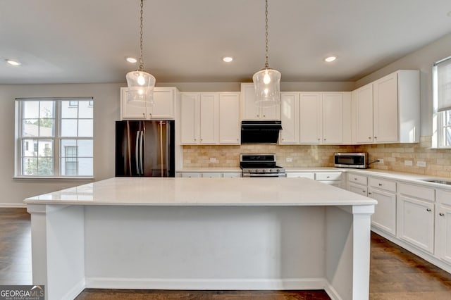 3360 Pickens St, Duluth, GA 30096 - kitchen with appliances with stainless steel finishes, healthy amount of natural light, a center island, exhaust hood, and recessed lighting