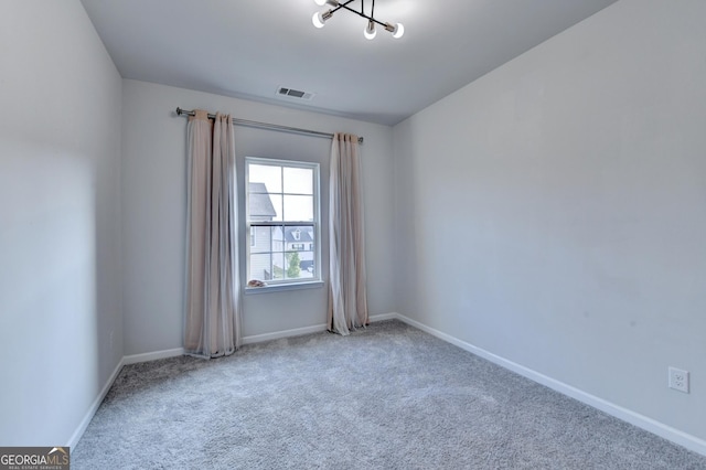 3360 Pickens St, Duluth, GA 30096 - carpeted spare room with a chandelier and baseboards