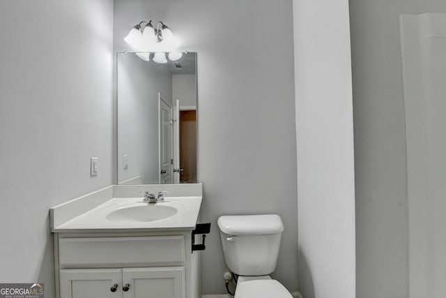 3360 Pickens St, Duluth, GA 30096 - half bathroom featuring toilet and vanity