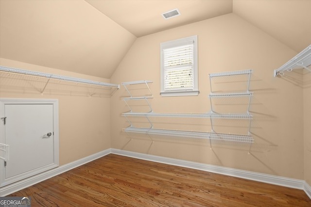 10565 Highgate Manor Ct, Duluth, GA 30097 - spacious closet with wood finished floors and vaulted ceiling