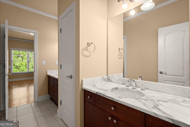 10565 Highgate Manor Ct, Duluth, GA 30097 - bathroom featuring vanity, ornamental molding, tile patterned flooring, and baseboards