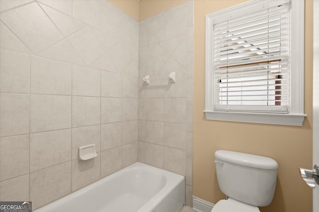 10565 Highgate Manor Ct, Duluth, GA 30097 - full bath featuring toilet, baseboards, and tub / shower combination