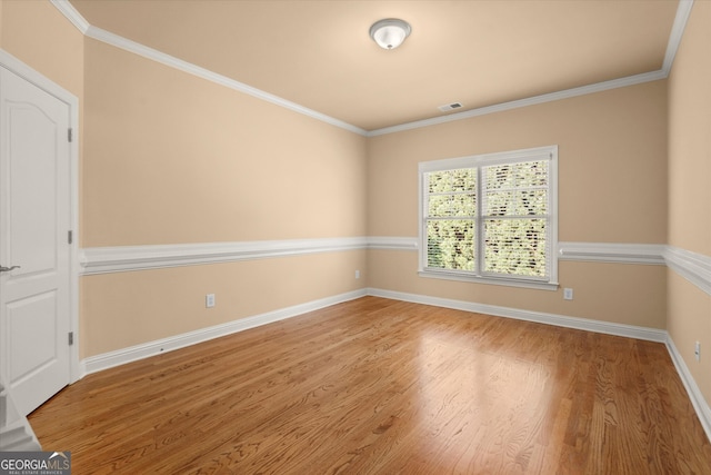 10565 Highgate Manor Ct, Duluth, GA 30097 - empty room featuring wood finished floors, baseboards, and crown molding