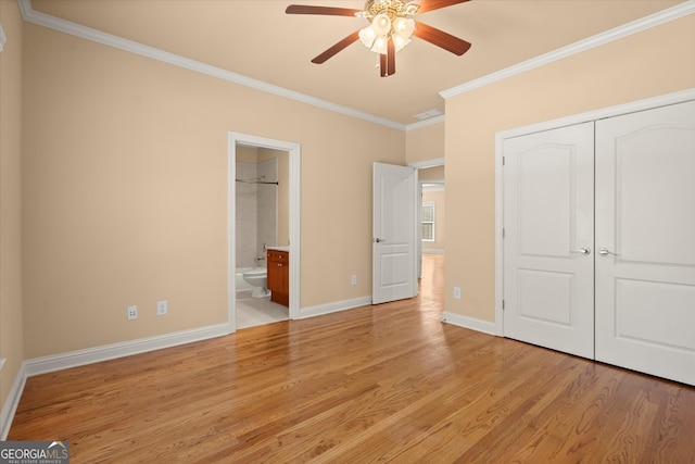 10565 Highgate Manor Ct, Duluth, GA 30097 - unfurnished bedroom featuring ornamental molding, light wood-style floors, baseboards, a closet, and ensuite bath
