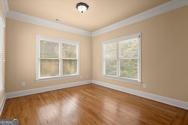 10565 Highgate Manor Ct, Duluth, GA 30097 - empty room with ornamental molding, baseboards, and wood finished floors