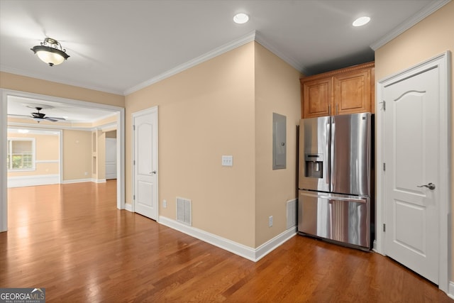 10565 Highgate Manor Ct, Duluth, GA 30097 - kitchen with stainless steel fridge with ice dispenser, electric panel, ceiling fan, wood finished floors, and crown molding