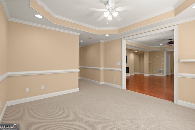 10565 Highgate Manor Ct, Duluth, GA 30097 - unfurnished room with a ceiling fan, carpet, a raised ceiling, crown molding, and recessed lighting