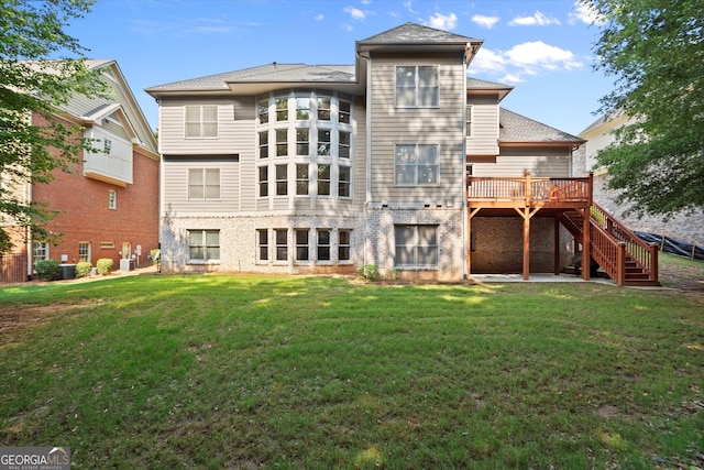 10565 Highgate Manor Ct, Duluth, GA 30097 - rear view of property with stairs, a deck, a lawn, and brick siding