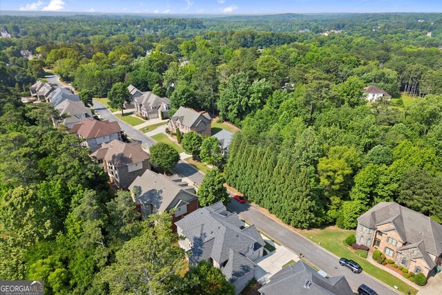 10565 Highgate Manor Ct, Duluth, GA 30097 - aerial perspective of suburban area with a forest