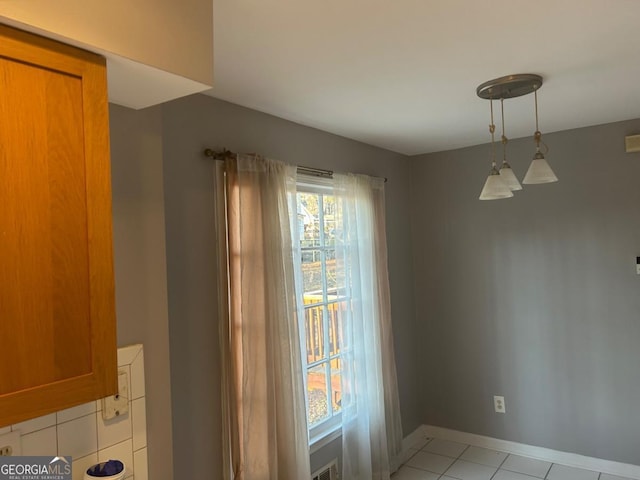 3808 Holy Cross Ct, Decatur, GA 30034 - unfurnished dining area featuring baseboards and light tile patterned floors