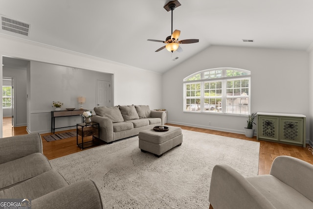 2605 Fort Apachee Trl, Dacula, GA 30019 - living room with a ceiling fan, lofted ceiling, wood finished floors, and baseboards