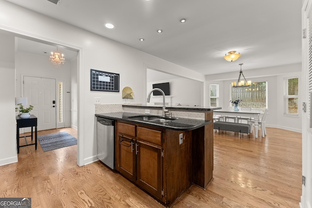 2605 Fort Apachee Trl, Dacula, GA 30019 - kitchen featuring a chandelier, a sink, stainless steel dishwasher, dark stone countertops, and recessed lighting