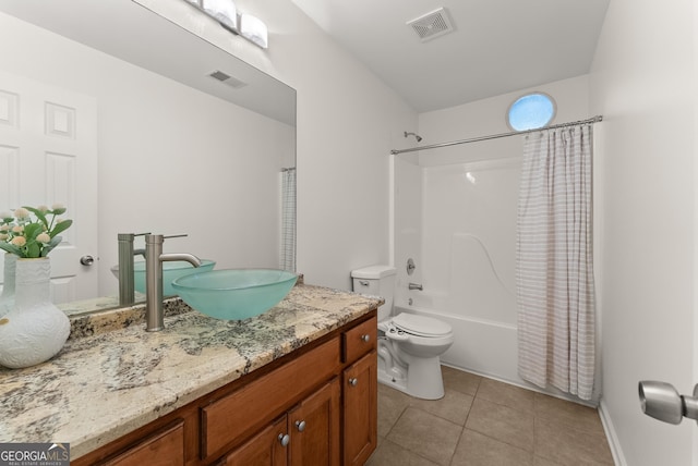 2605 Fort Apachee Trl, Dacula, GA 30019 - full bath featuring toilet, tile patterned flooring, vanity, shower / bath combination with curtain, and baseboards