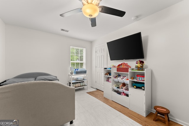 2605 Fort Apachee Trl, Dacula, GA 30019 - living room with ceiling fan, light wood-style floors, and baseboards