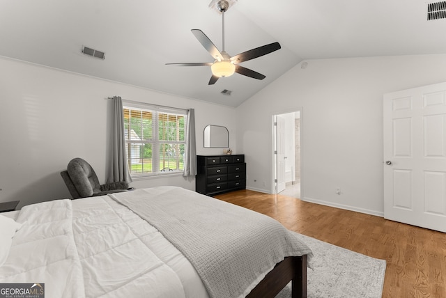 2605 Fort Apachee Trl, Dacula, GA 30019 - bedroom featuring vaulted ceiling, wood finished floors, and a ceiling fan