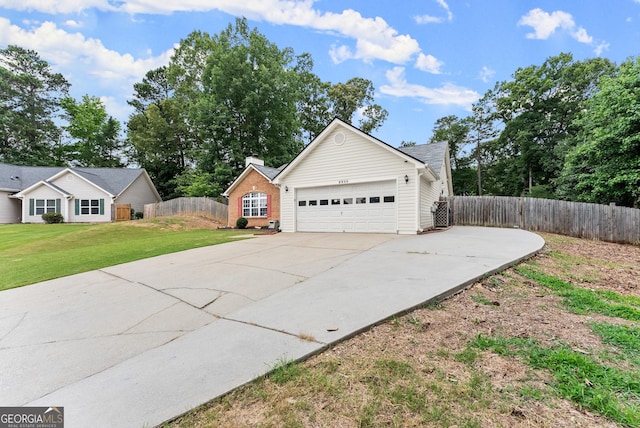 2605 Fort Apachee Trl, Dacula, GA 30019 - view of side of property featuring driveway and a garage