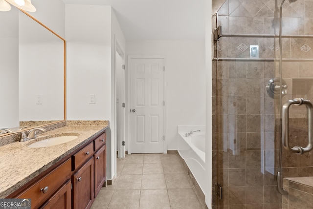 2605 Fort Apachee Trl, Dacula, GA 30019 - bathroom featuring vanity, tile patterned floors, a shower stall, and a garden tub