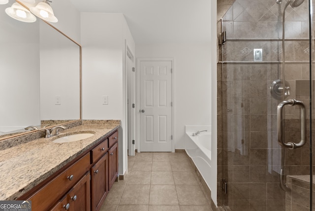 2605 Fort Apachee Trl, Dacula, GA 30019 - full bath featuring vanity, a bath, tile patterned floors, and a stall shower
