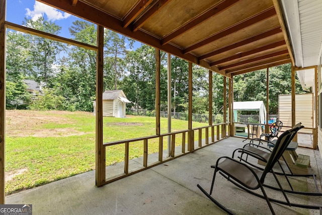 2605 Fort Apachee Trl, Dacula, GA 30019 - sunroom / solarium featuring view of wooded area