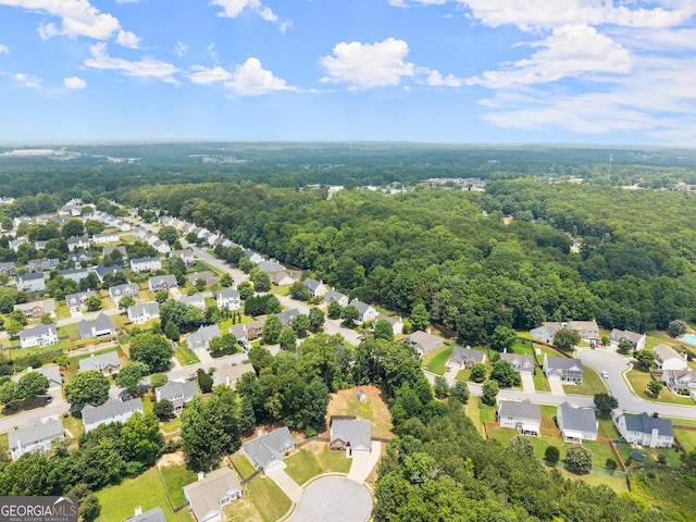 2605 Fort Apachee Trl, Dacula, GA 30019 - aerial view of residential area featuring a forest