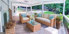 241 Sarann Ct NW, Lilburn, GA 30047 - sunroom featuring an outdoor living space and ceiling fan