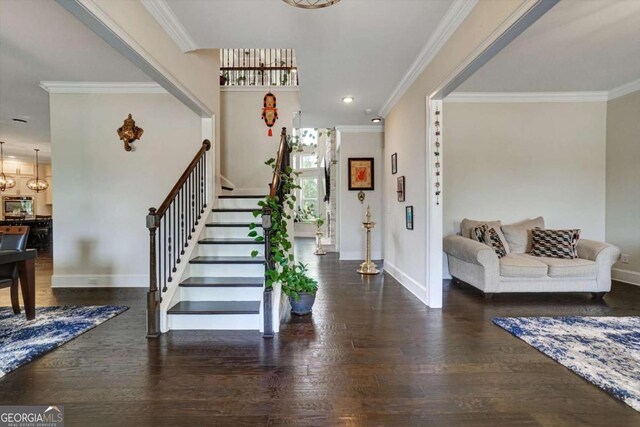 1835 Henley Way, Alpharetta, GA 30009 - entryway featuring stairs, crown molding, wood finished floors, baseboards, and a chandelier