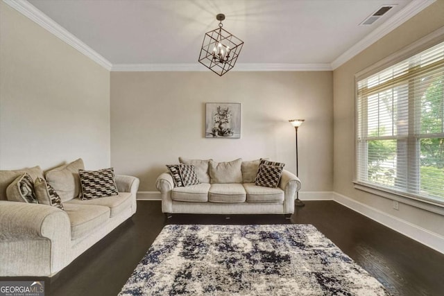 1835 Henley Way, Alpharetta, GA 30009 - living room featuring dark wood-type flooring, crown molding, baseboards, and a chandelier