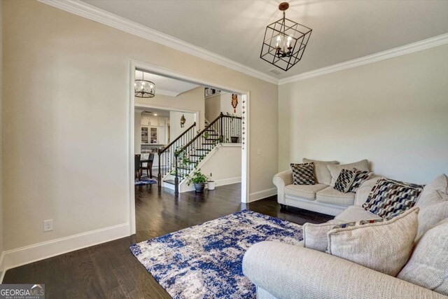 1835 Henley Way, Alpharetta, GA 30009 - living area featuring a chandelier, stairs, baseboards, crown molding, and wood finished floors