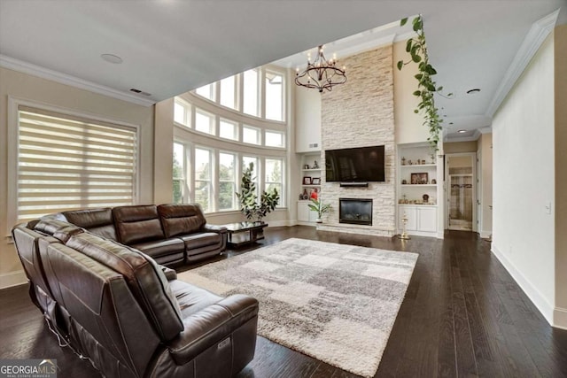 1835 Henley Way, Alpharetta, GA 30009 - living room with crown molding, a chandelier, baseboards, a fireplace, and dark wood-type flooring