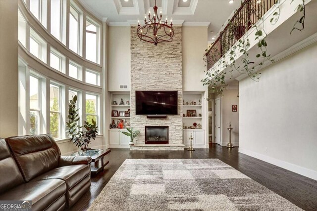 1835 Henley Way, Alpharetta, GA 30009 - living area featuring a high ceiling, healthy amount of natural light, a chandelier, crown molding, and dark wood-type flooring