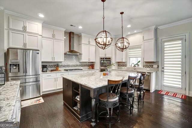 1835 Henley Way, Alpharetta, GA 30009 - kitchen featuring wall chimney exhaust hood, stainless steel appliances, a center island, white cabinetry, and a kitchen breakfast bar