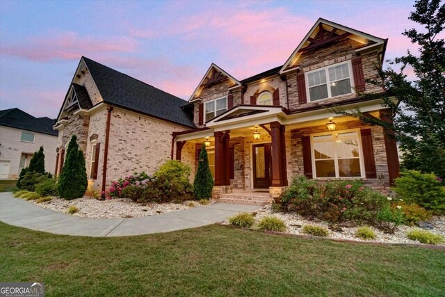 1835 Henley Way, Alpharetta, GA 30009 - craftsman-style home with stone siding, a front yard, and brick siding