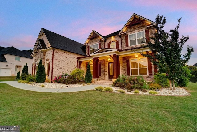 1835 Henley Way, Alpharetta, GA 30009 - craftsman inspired home featuring stone siding, a lawn, covered porch, and brick siding