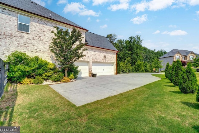 1835 Henley Way, Alpharetta, GA 30009 - view of grassy yard with driveway and an attached garage