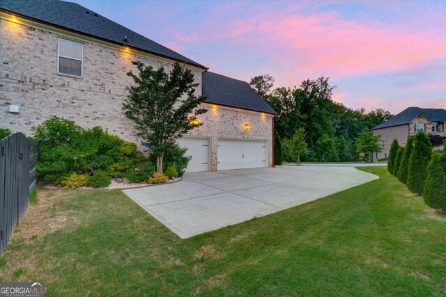 1835 Henley Way, Alpharetta, GA 30009 - view of side of home with concrete driveway, brick siding, and an attached garage