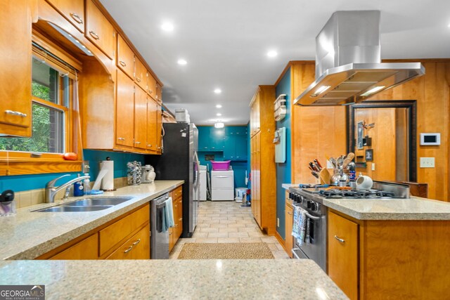 1138 Berkeley Rd, Avondale Estates, GA 30002 - kitchen featuring a sink, appliances with stainless steel finishes, island range hood, washer and dryer, and brown cabinets