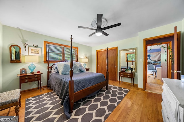 1138 Berkeley Rd, Avondale Estates, GA 30002 - bedroom with light wood-style floors, baseboards, a closet, and a ceiling fan